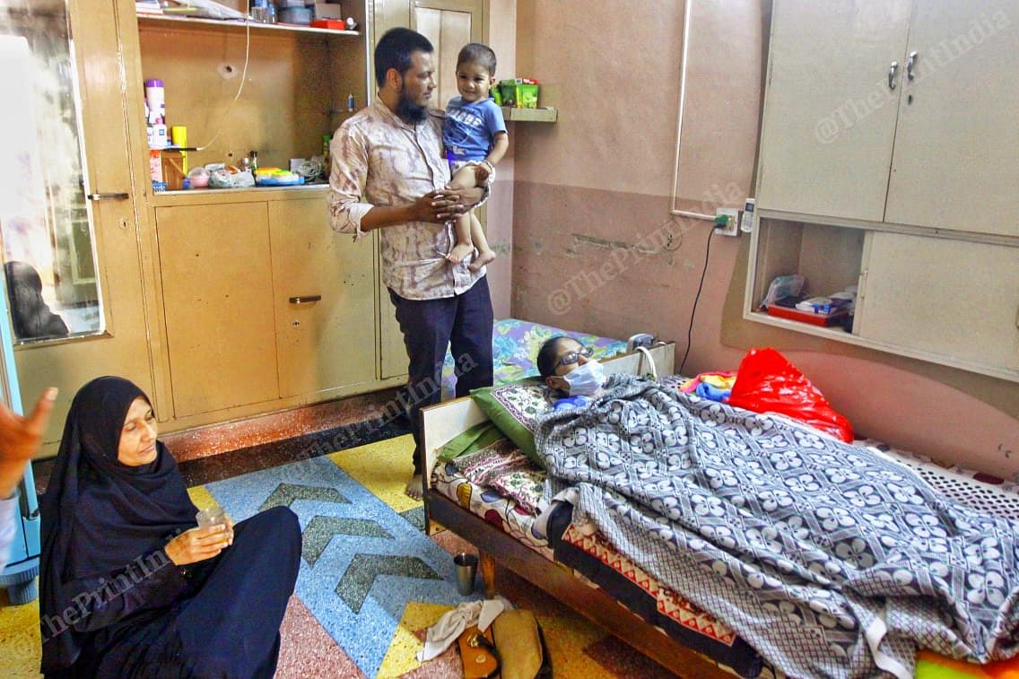 Misbah rests while Faisal plays with their one-year-old son Mohammed Khubaib | Praveen Jain | ThePrint