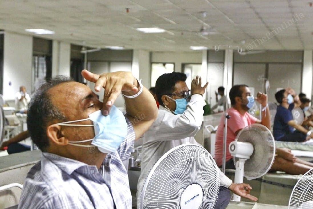 A recovering Covid-19 patient does deep breathing to improve his recovery from the infection | Photo: Praveen Jain | ThePrint