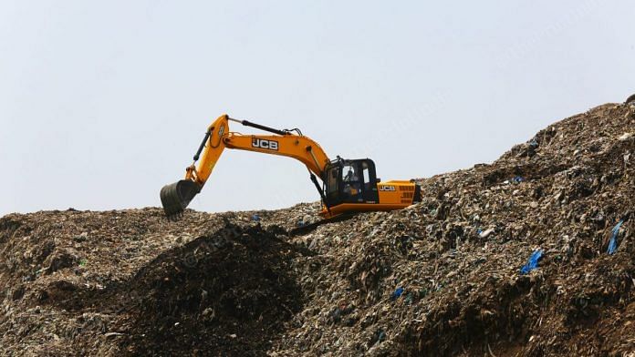 A bulldozer at the Ghazipur landfill | Photo: Suraj Singh Bisht | ThePrint