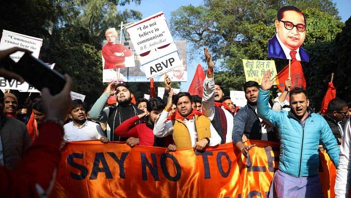ABVP activists hold up placards and cut-outs of Swami Vivekananda and Dr B.R. Ambedkar at a demonstration | File photo: ANI