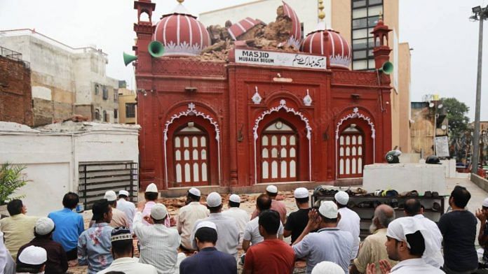 People pray in the courtyard of the Mubarak Begum Masjid following the collapse of one of its domes in New Delhi, on 20 July 2020 | Manisha Mondal | The Print