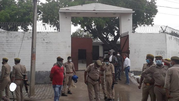 Police personnel at the residence of criminal Vikas Dubey, after an encounter in Bikaru village where 8 police personnel lost their lives | PTI