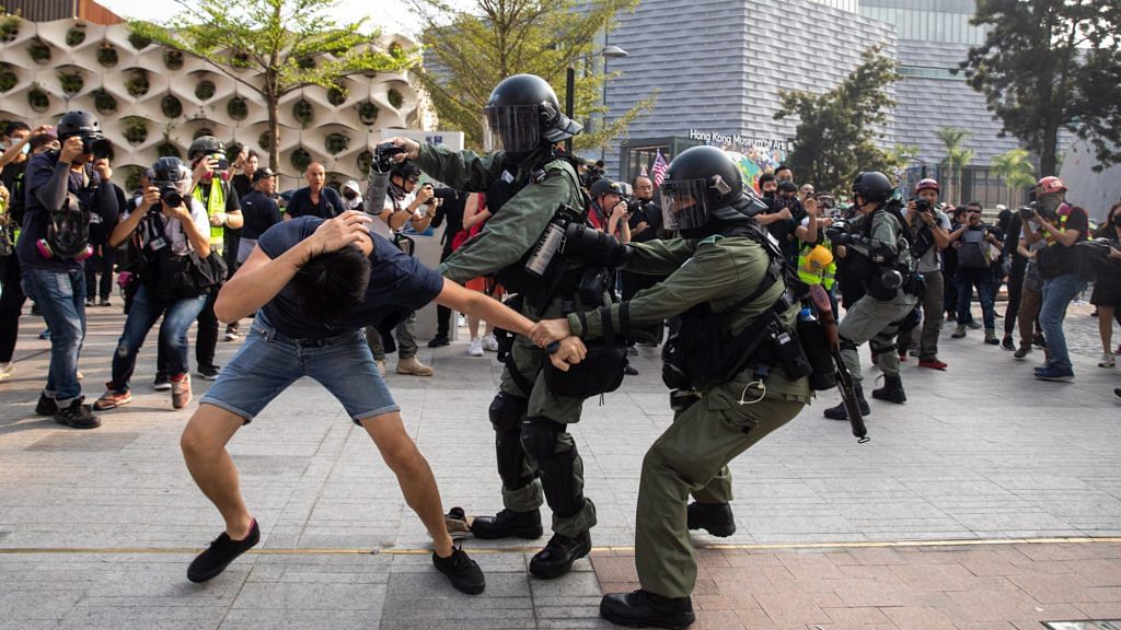 File photo of riot police attempting to apprehend and arrest a demonstrator during a protest in the Tsim Sha Tsui district of Hong Kong