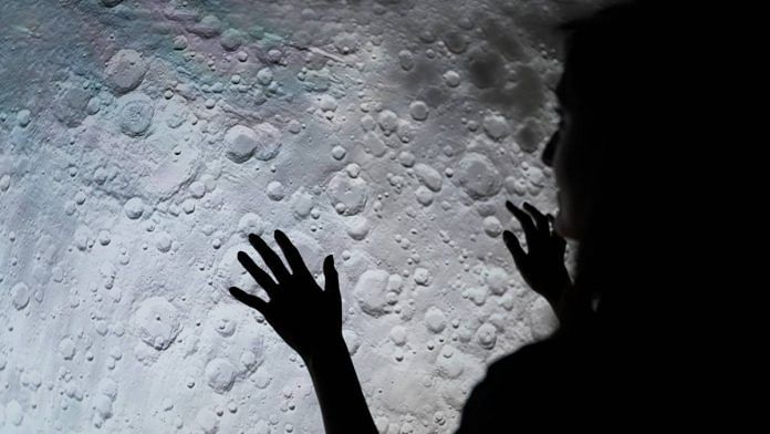 A woman studies the moon's surface | Representational image | ThisIsEngineering | Pexels