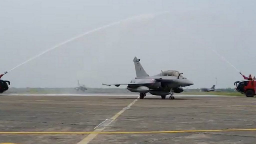 An IAF Rafale fighter jet is welcomed at the Ambala air base with a water salute | Twitter screengrab