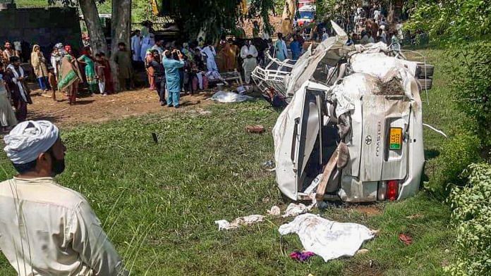 People gather at the spot where a bus carrying Sikh pilgrims was hit by a train in Sheikhupura district in Pakistans Punjab, Friday, July 3, 2020. Reportedly, 19 passengers killed and 8 injured in the accident. | PTI