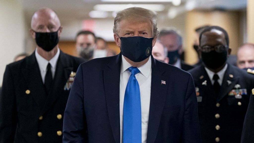 Donald Trump wears a mask while visiting Walter Reed National Military Medical Center in Bethesda, Maryland, on July 11. Chris Kleponis | Bloomberg