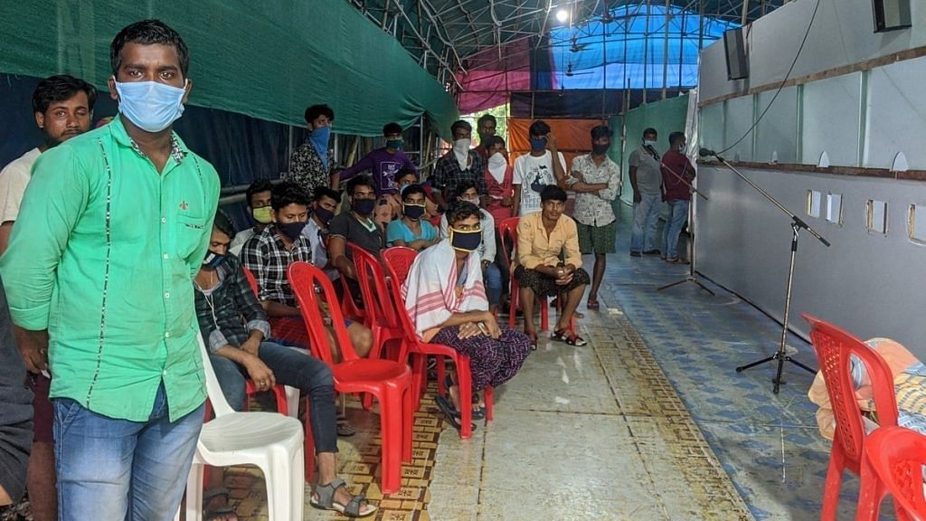 Migrant workers waiting for their turn at a swab collection facility near the Assam-West Bengal border gate | Photo: Yimkumla Longkumer/ThePrint
