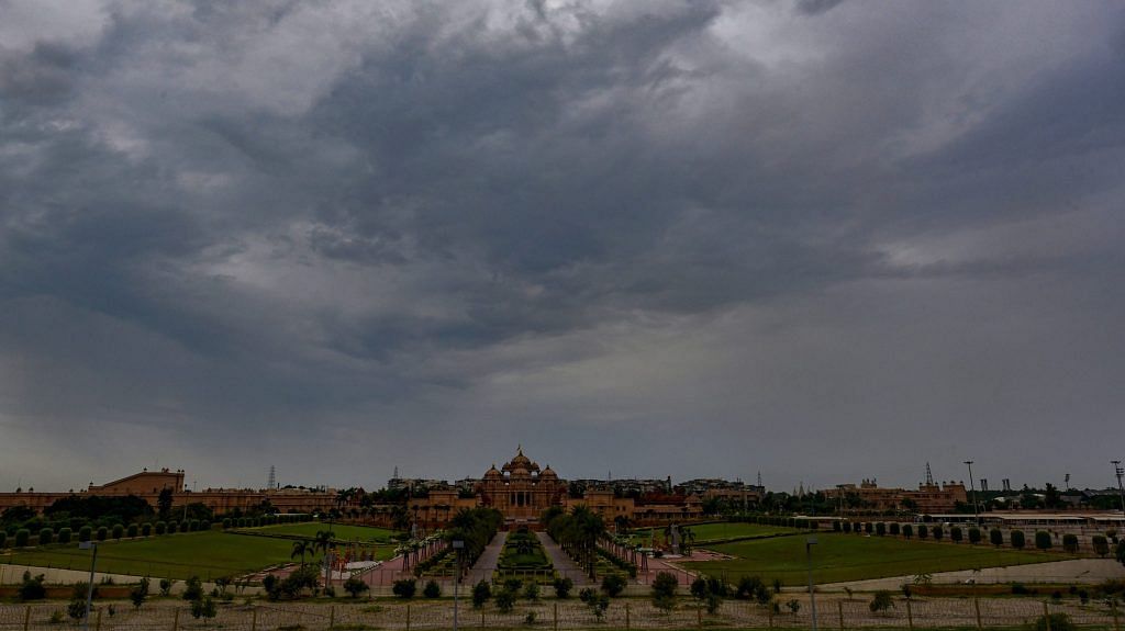 Dark clouds gather in the sky over Akshardham temple, in New Delhi | PTI
