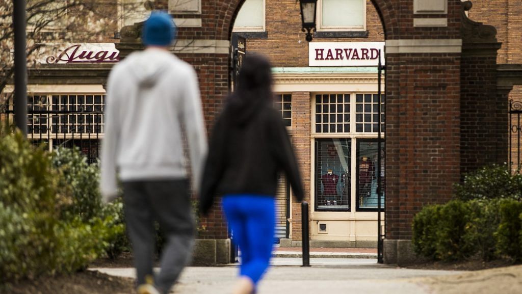 File photo of pedestrians walk through Harvard Yard on the closed Harvard University campus in Cambridge, Massachusetts on 20 April