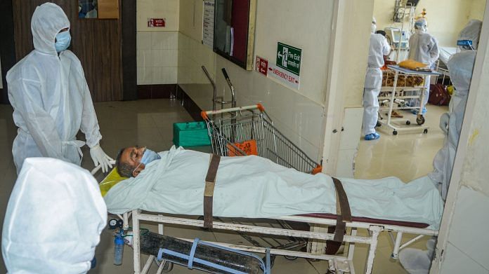 Medics shift a patient to Covid ward of a hospital in Karad