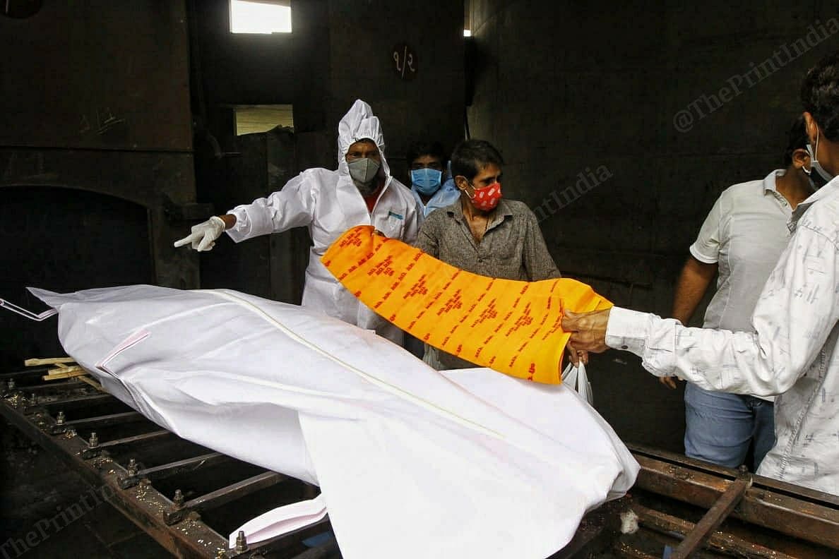 At the crematorium, Abdul makes sure the body of the Covid victim is covered with a yellow cloth on which is written an ode to Lord Ram | Praveen Jain | ThePrint