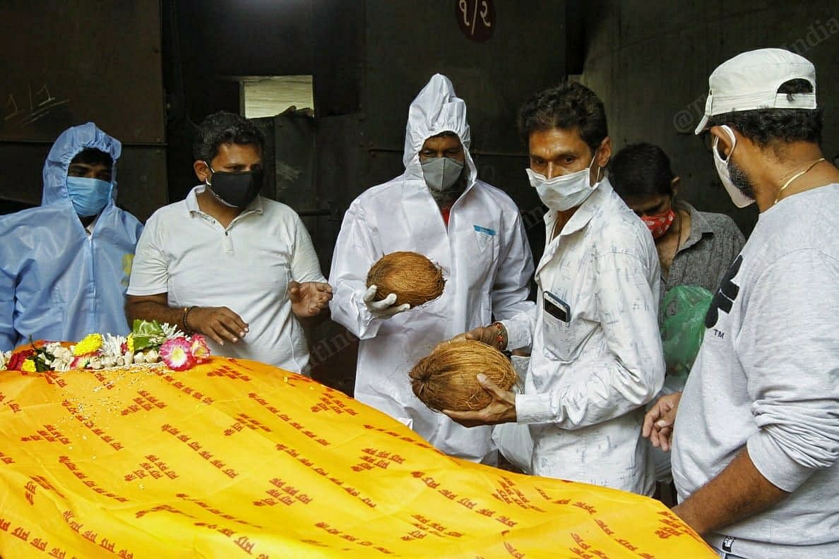 All the paraphernalia needed for a cremation is used, including coconuts and camphor | Praveen Jain | ThePrint