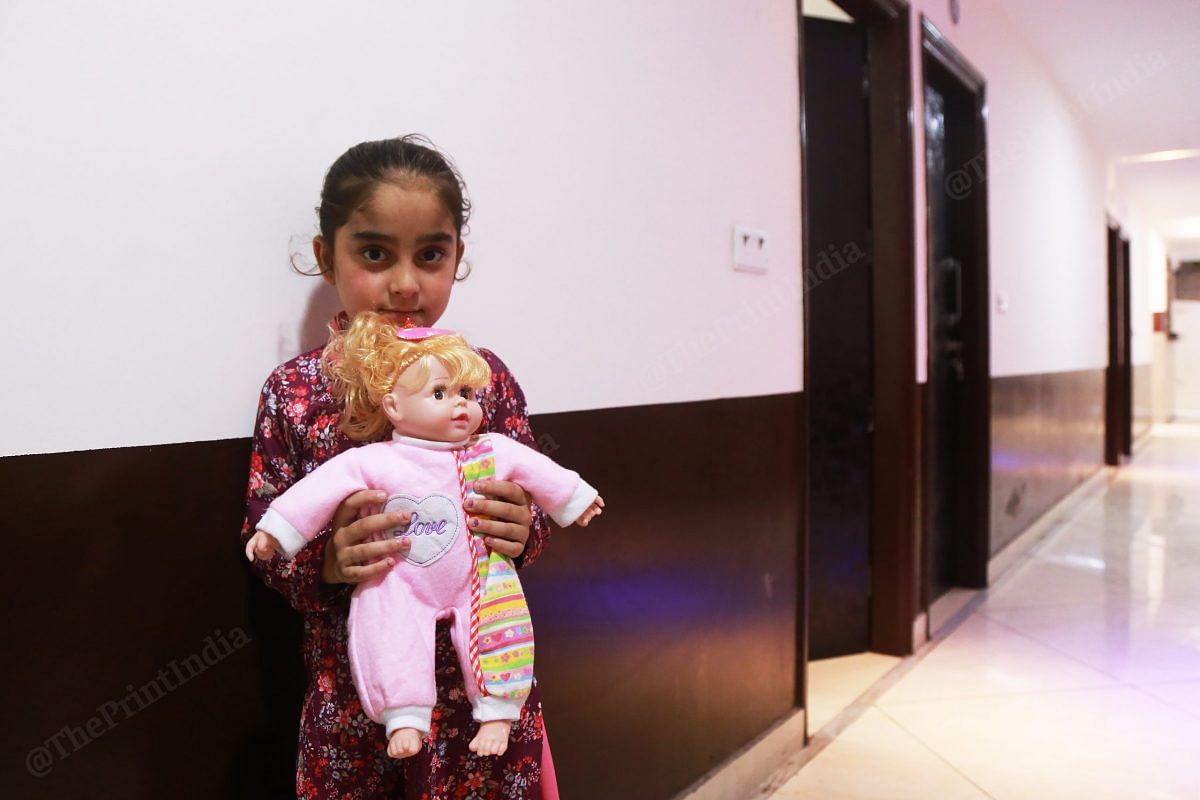 Gorjeet Singh’s daughter Gulvinder holds the last doll that is left with herher last remaining doll. She was at the gurudwara in Kabul when the attack happened, and she saw her grandfather die. She was also injured in the blast | Manisha Mondal | ThePrint
