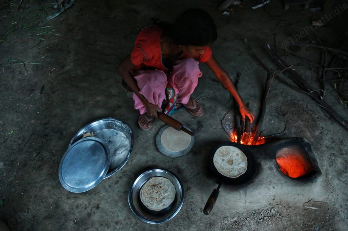 They still like to use the old fashion ovens to cook in order to save | Photo: Manisha Mondal | ThePrint