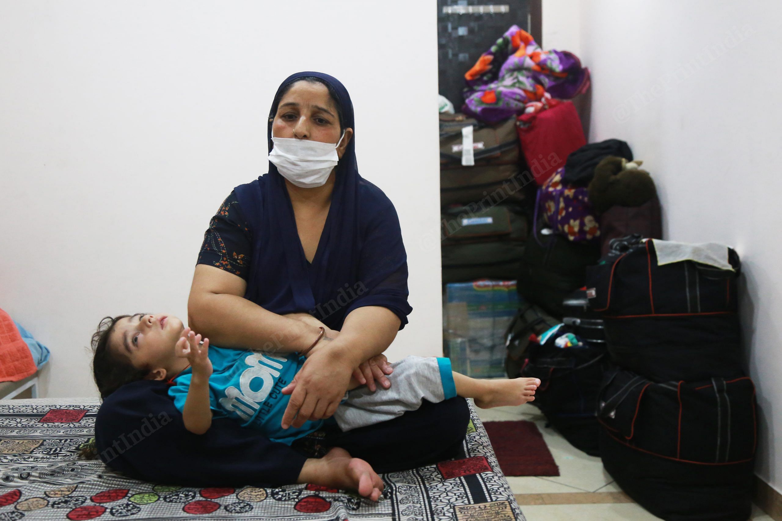 Gorjeet’s mother, Harbansh Kaur, takes care of her grandson. She saw her husband die in the Kabul attack. She said, they had been trying to leave the country for the past five months. They leave behind homes and painstakingly built businesses and shops | Manisha Mondal | ThePrint