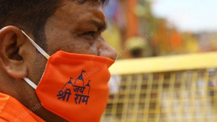 An ascetic wears a mask imprinted with 'Jai Shri Ram' in Ayodhya on the day of the Ram Mandir bhoomi pujan | Photo: Suraj Singh Bisht | ThePrint