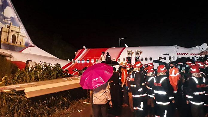 Rescue operation underway after an Air India Express flight with passengers on board en route from Dubai skidded off the runway while landing, at Karippur in Kozhikode, Friday, 7 Aug, 2020. | PTI