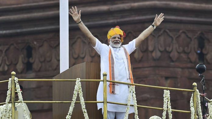 Prime Minister Narendra Modi waving to the crowd | Photo: Arun Sharma | PTI File Photo