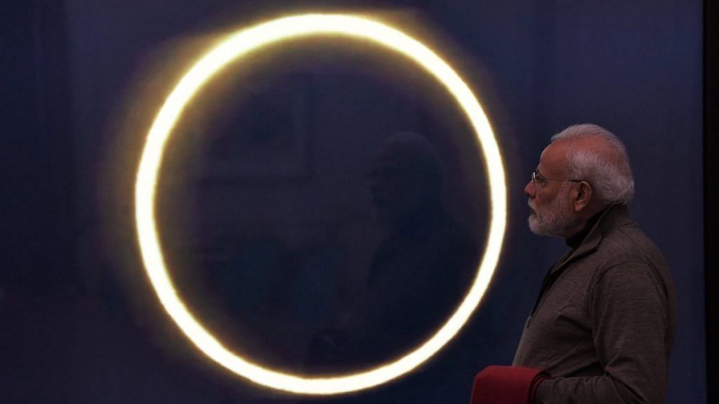 Representational image|. PM Modi looks at a solar eclipse in 2019 | Facebook/narendramodi