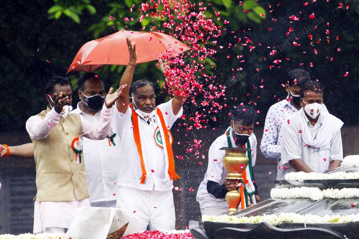 Congress party members from Tamil Nadu throw flowers. Every year they come bring Jyoti Kalash | Photo: Praveen Jain | ThePrint
