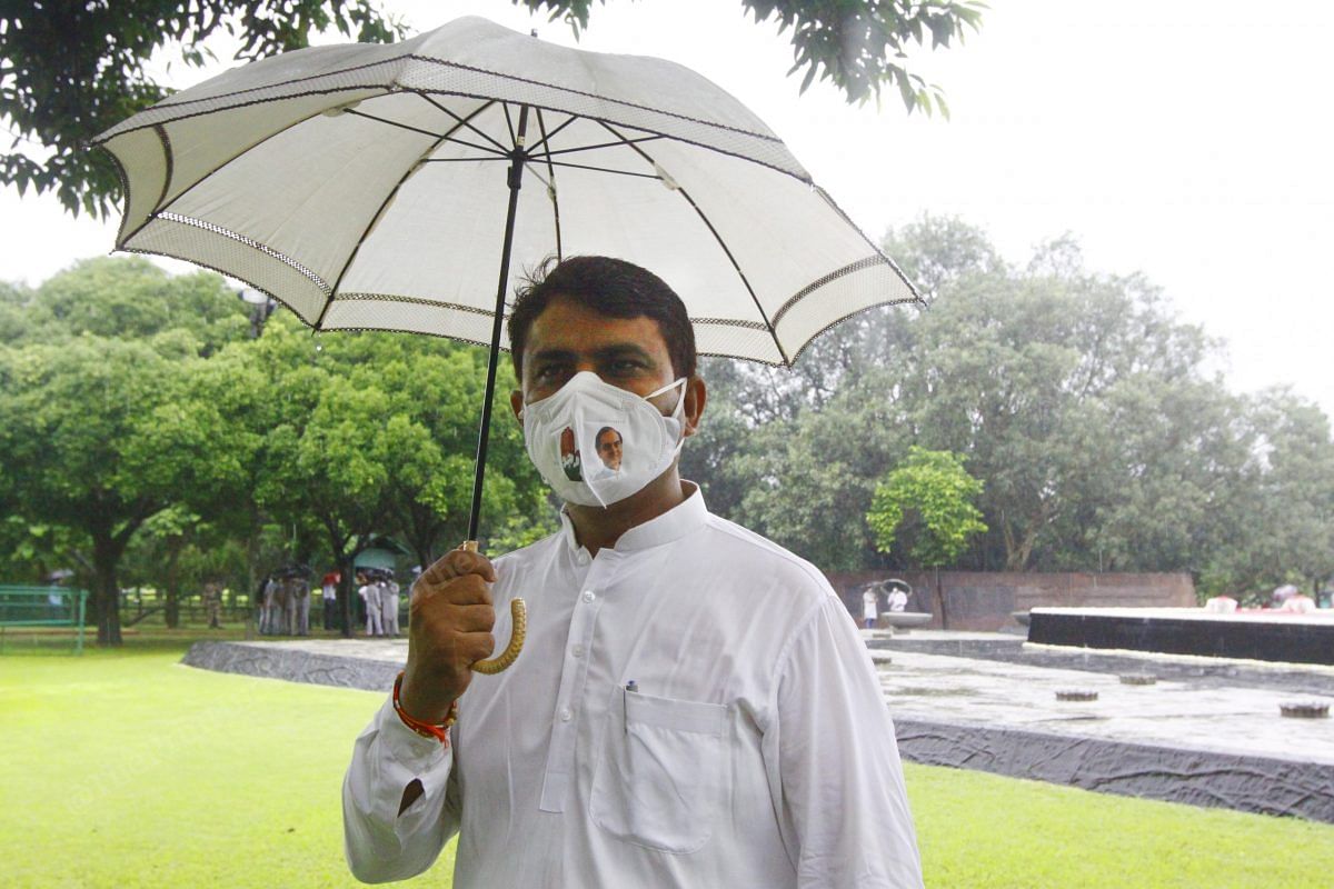 President of Delhi Pradesh Congress Committee Anil Kumar Chaudhary wears a mask drawn Rajiv Gandhi's face on it | Photo: Praveen Jain | ThePrint