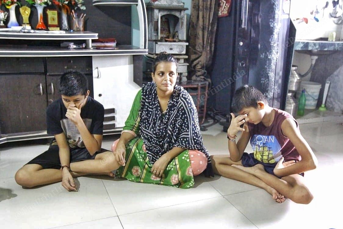 Shalini Sarvaiya with her sons Jai and Kabir. Her husband allegedly committed suicide on 8 June | Praveen Jain | ThePrint