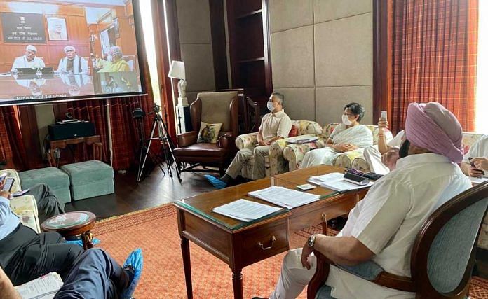 Punjab CM Amarinder Singh discusses the SYL canal issue with his Haryana counterpart Manohar Lal Khattar and Union minister Gajendra Singh Shekhawat (both seen on the screen) at a meeting Tuesday | By special arrangement