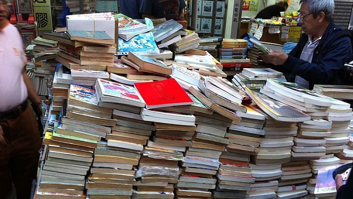 File photo of a a vendor selling secondhand books in Hong Kong