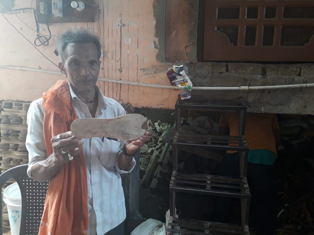 Ayodhya shopkeeper Bashir Ahmad with a khadaun | Prashant Srivastava | ThePrint