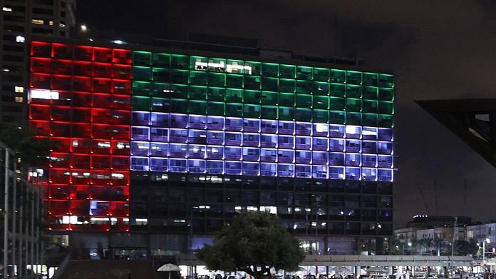 The city hall in the Israeli coastal city of Tel Aviv is lit up in the colours of the UAE national flag on 13 August.