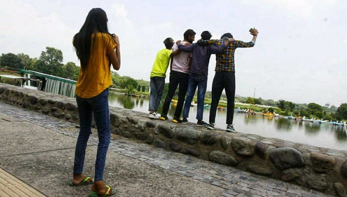 Young people take pictures at Sukhna Lake in Chandigarh, which has now reopened for weekends | Praveen Jain | ThePrint