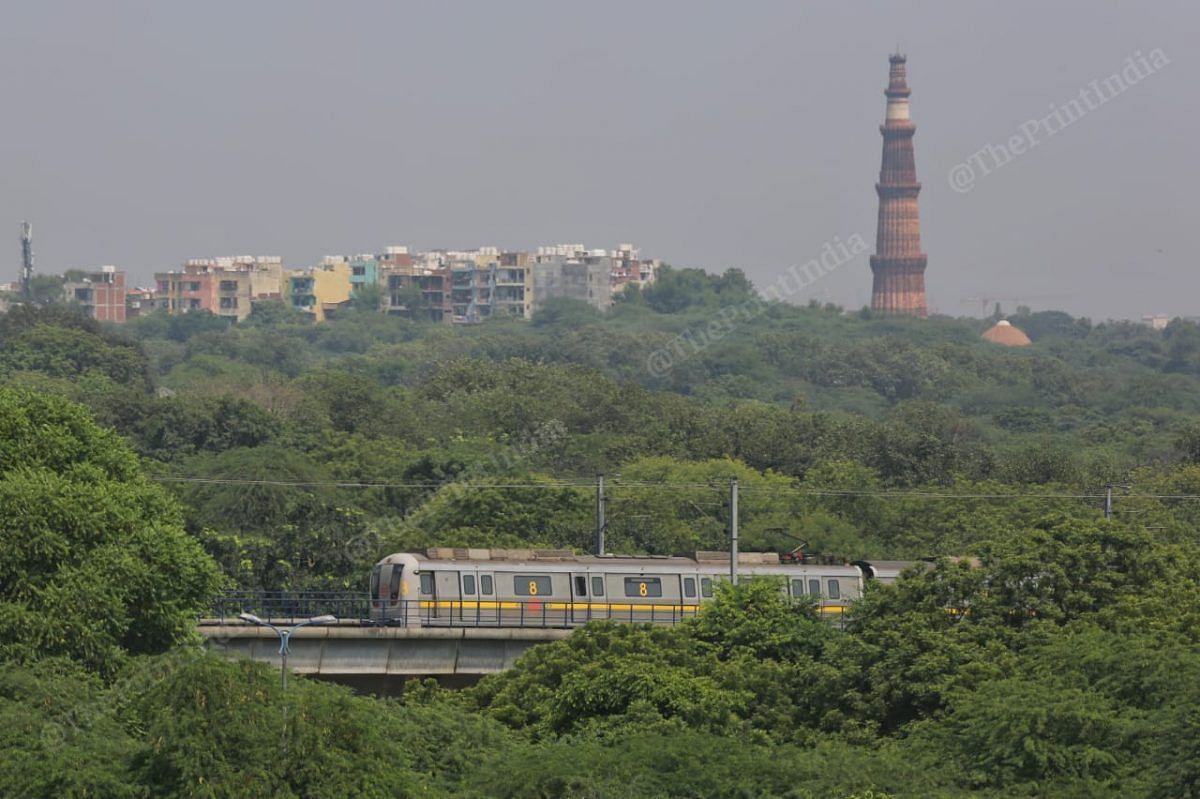 Yellow line metro with Qutub Minar in backdrop | Photo: Suraj Singh Bisht | ThePrint