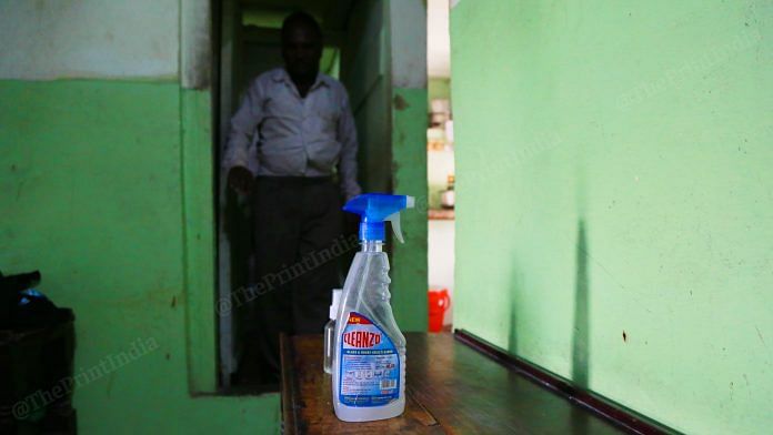 A bottle of sanitiser kept outside a room at one of the brothels of GB Road | Manisha Mondal | ThePrint