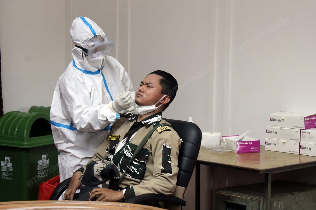 A policeman was being tested for coronavirus at the Delhi Assembly | Photo: Suraj Singh Bisht | ThePrint