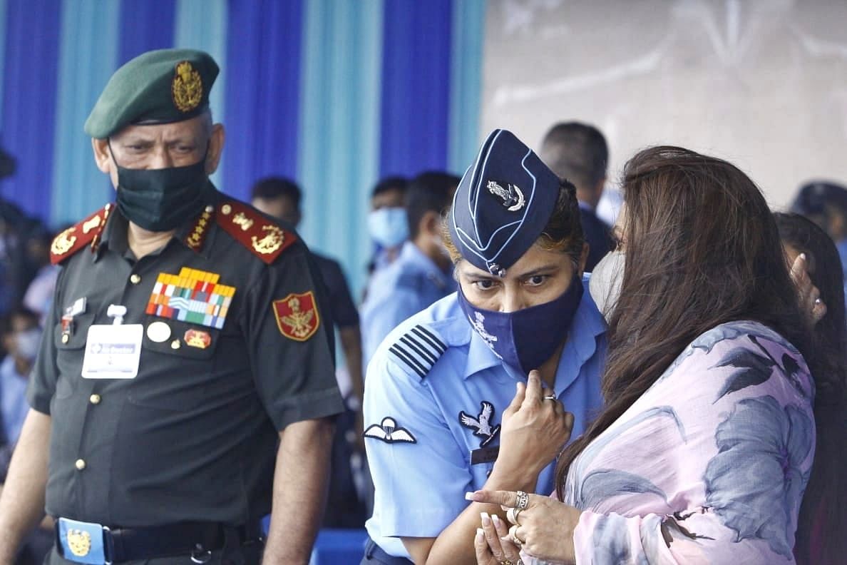 IAF chief Air Chief Marshal RKS Bhadauria’s wife Asha Bhadauria speaks to an IAF officer as CDS Gen Bipin Rawat looks on | Photo: Praveen Jain | ThePrint