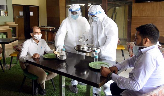 Staff in PPE suits at a restaurant in Bihar | Representational image | ANI