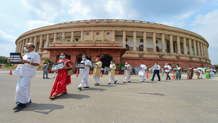 Opposition MPs march from Gandhi statue to Ambedkar statue in protest against the recent farm and labour bills, during the ongoing Monsoon Session, at Parliament House in New Delhi | Kamal Kishore | PTI