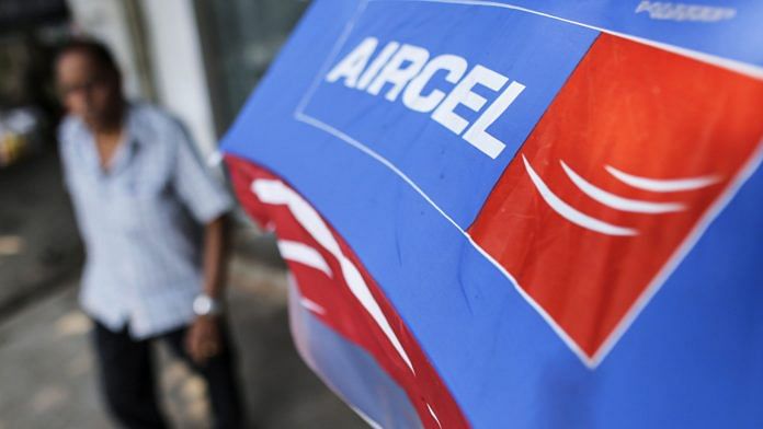 A banner for Aircel Ltd. is displayed outside a mobile phone store in Mumbai on 24 October, 2016. | Photographer: Dhiraj Singh | Bloomberg