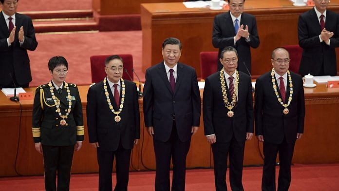 Xi Jinping presents medals to honour people who fought against the pandemic, on Sept. 8. | Photographer: Nicolas Asfouri | AFP/Getty Images via Bloomberg
