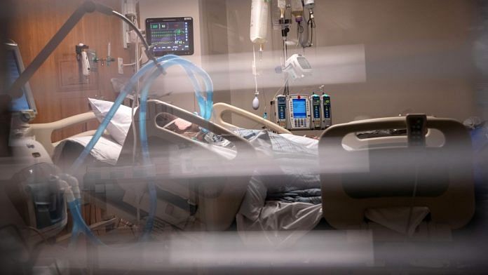 Breathing tubes hang next to a Covid-19 patient on a ventilator in Connecticut | Bloomberg