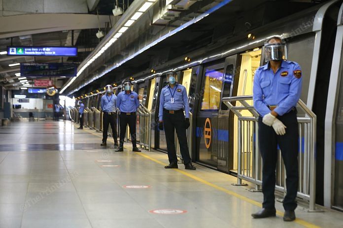 Metro employs are deployed at every entry gate of train. The trains will remain open for longer transition for smooth entry inside the bogie | Photo: Suraj Singh Bisht | ThePrint