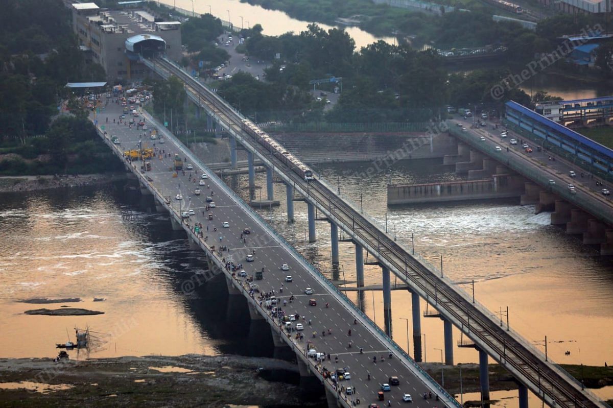 The blue line metro crosses the Yamuna river near Okhla Barrage | Photo: Suraj Singh Bisht | ThePrint