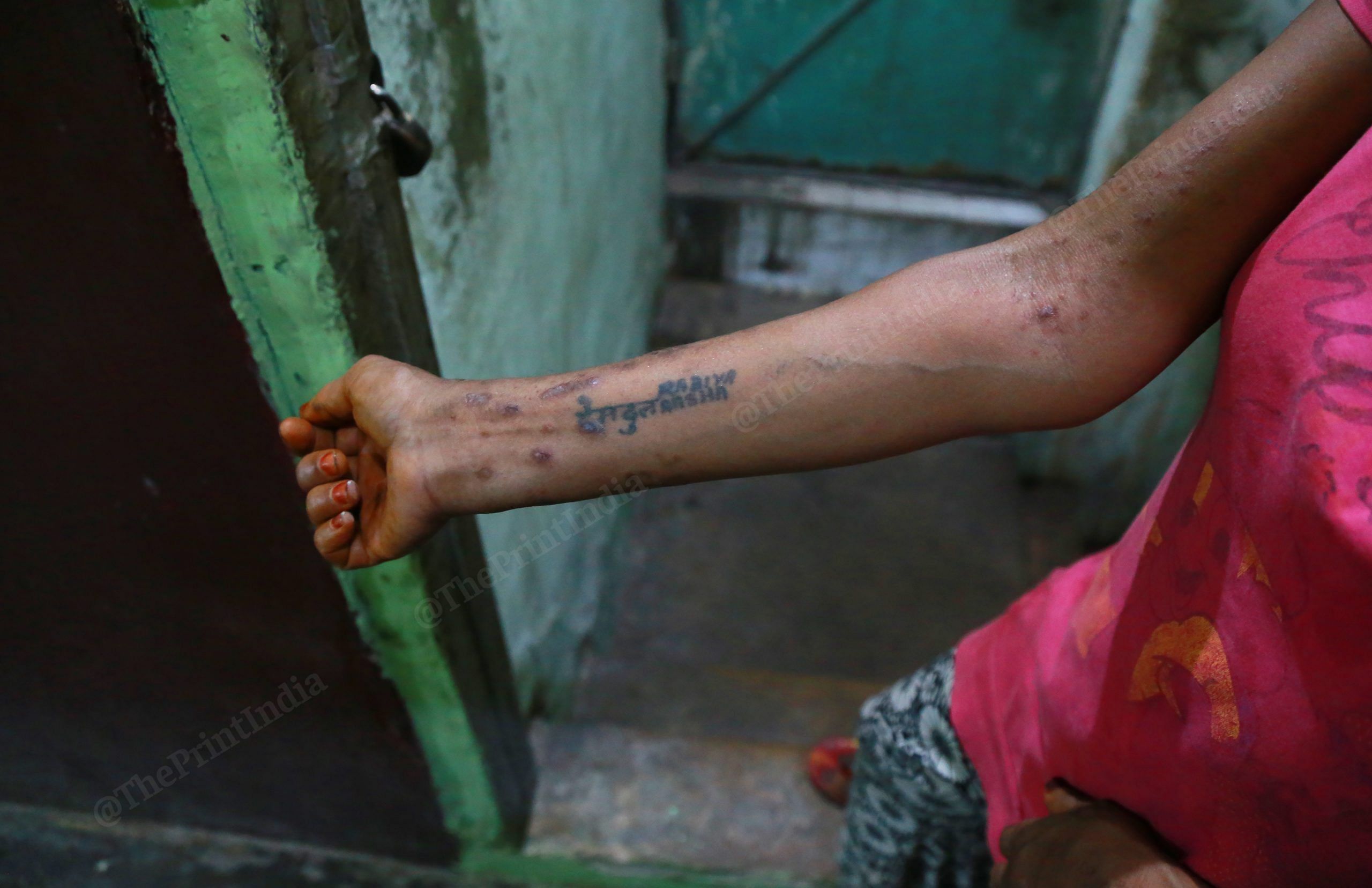 A sex worker shows the names of her family members, tattooed on her forearm | Manisha Mondal | ThePrint