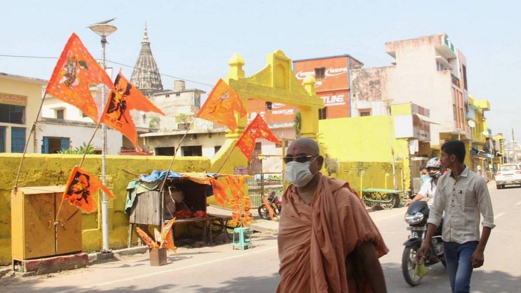 Residents walk past the Hanuman Garhi temple in Ayodhya on 30 September 2020, the day a special CBI court ruled that the 1992 Babri mosque demolition wasn't planned in advance and acquitted all accused | PTI