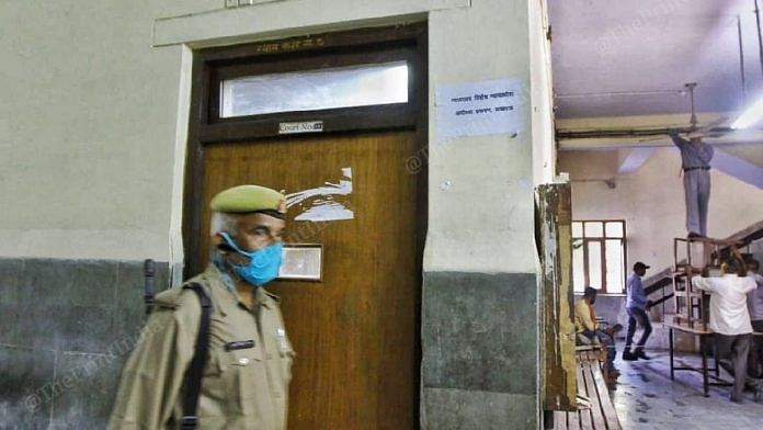 A policeman guards the door to courtroom No.18, which has been hearing the Babri Masjid demolition criminal case, a day before the verdict | Photo: Praveen Jain | ThePrint