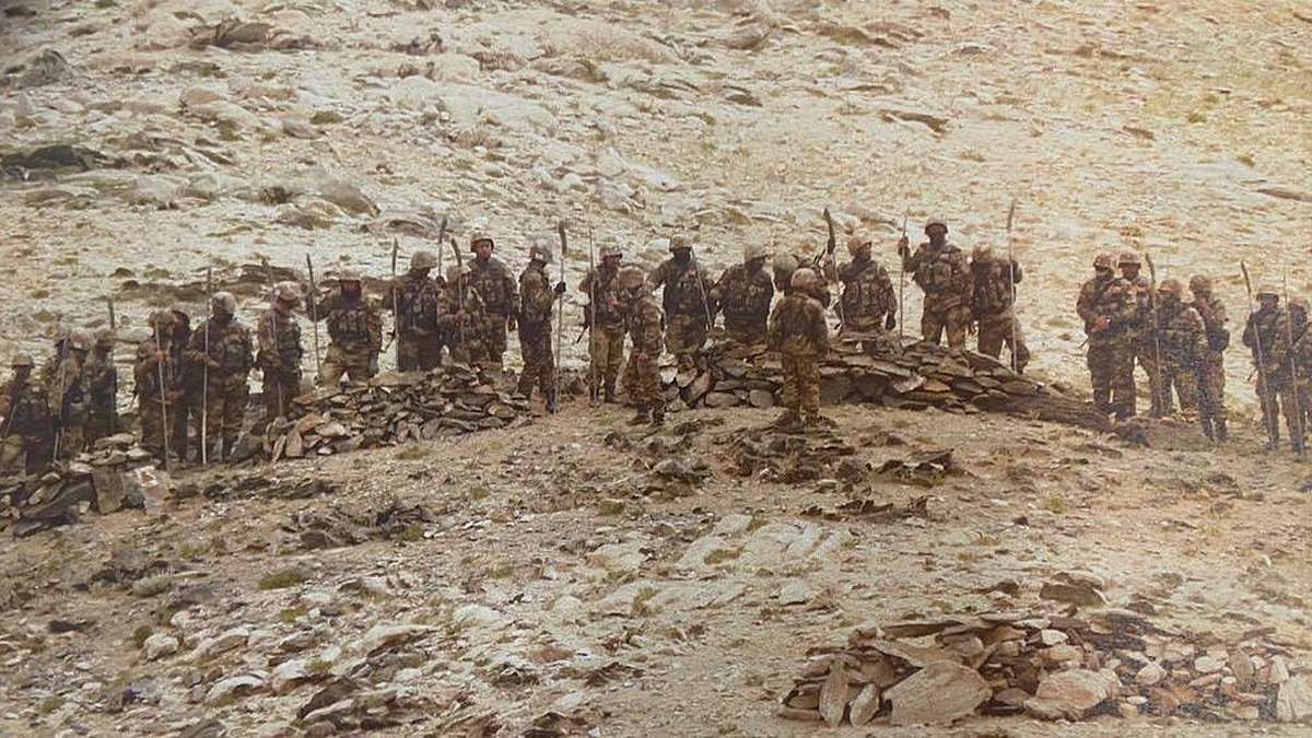 A picture showing Chinese soldiers carrying rifles and iron rods with machete-like heads near India's forward locations in Rezang La | By special arrangement