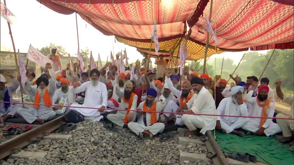 Farmers protest against the new farm laws on a railway track near Amritsar, Punjab | ANI file photo