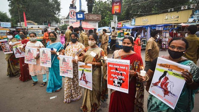 Activists of various organisations (SFI, DYFI & AIDWA) hold a candlelight vigil during a protest over the death of Hathras gang-rape victim, in Vijayawada, Wednesday, 30 September 2020 | PTI