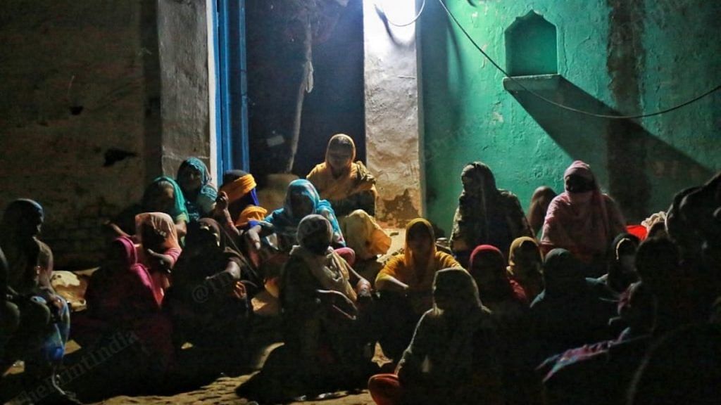 People gathered at the house of the woman who was allegedly gang-raped in Hathras, Uttar Pradesh | Photo: Manisha Mondal |ThePrint